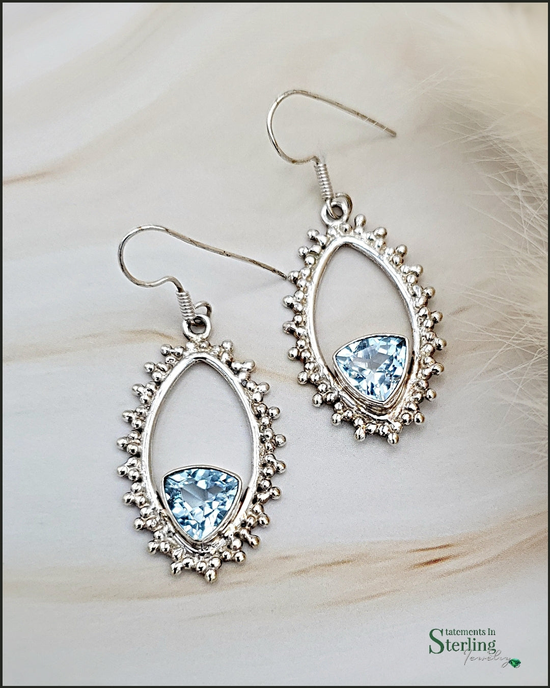 <transcy>Boucles d'oreilles Trillion avec topaze bleue suisse</transcy>