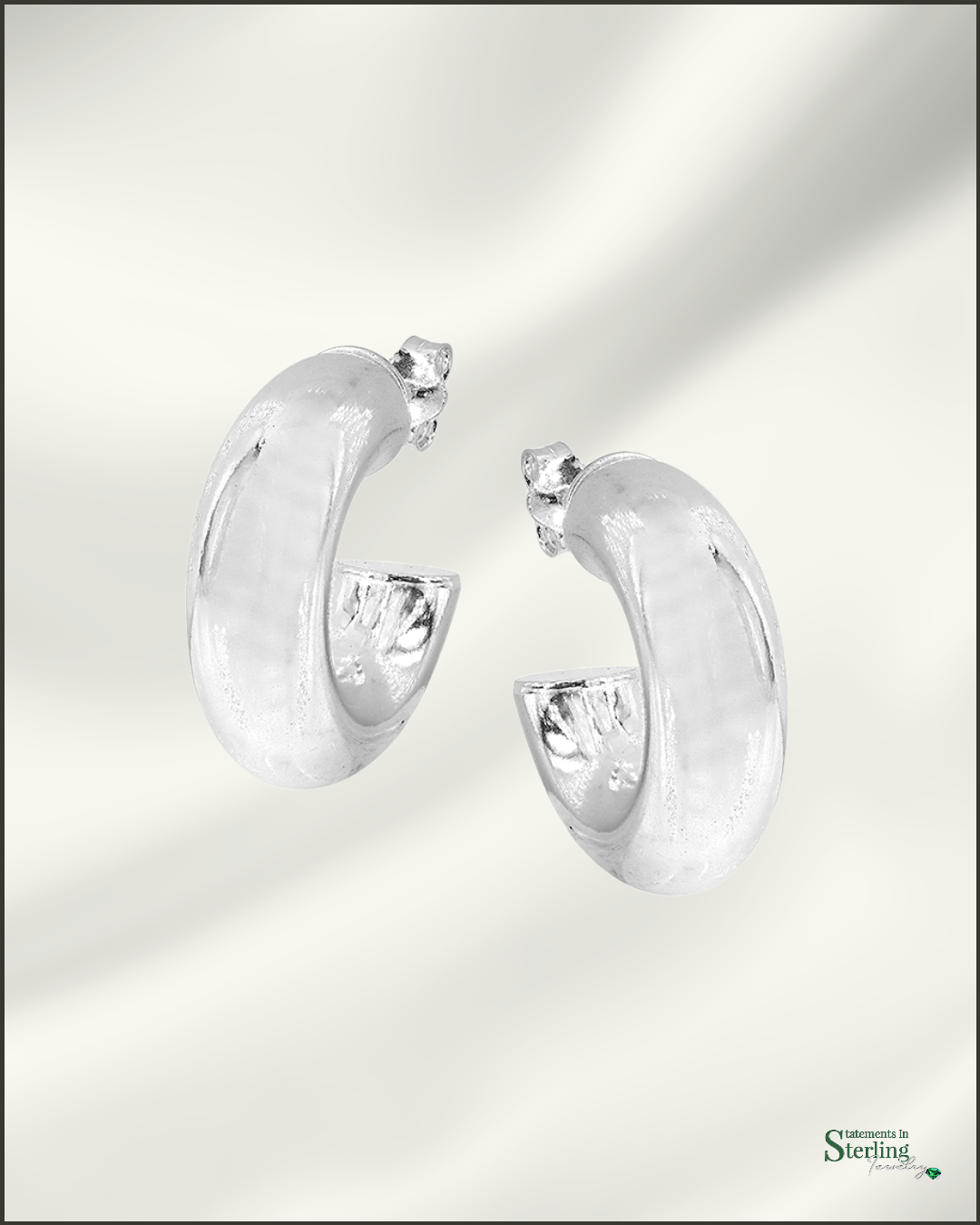 Sterling Silver Puffy Huggie Earrings in Rhodium