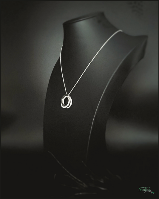 White Topaz, Black Spinel and Sterling Silver Interlocking Circles Pendant